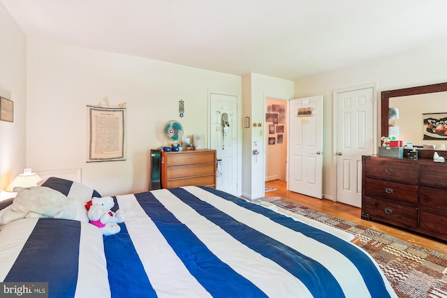 bedroom featuring wood finished floors