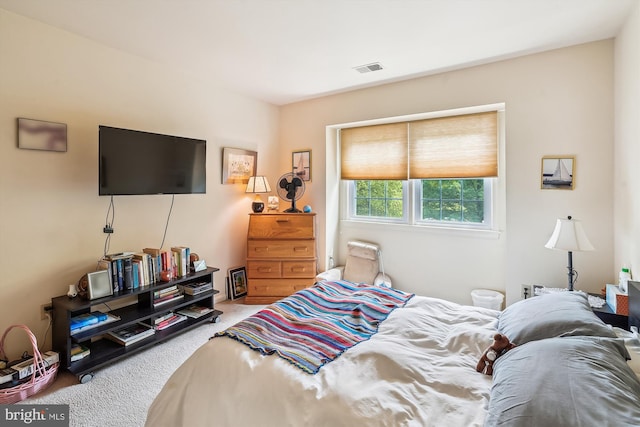 bedroom featuring carpet floors and visible vents