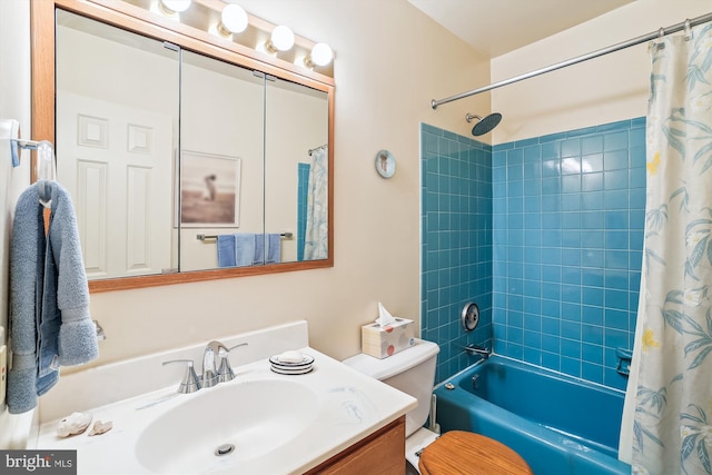 bathroom featuring toilet, vanity, and shower / bath combo
