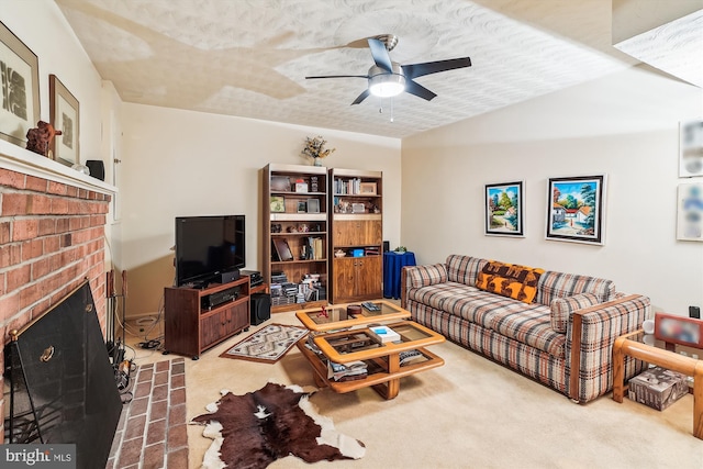 living room with ceiling fan and a brick fireplace