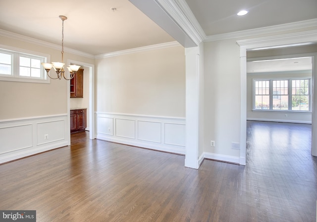 interior space featuring a chandelier, plenty of natural light, and dark wood-type flooring
