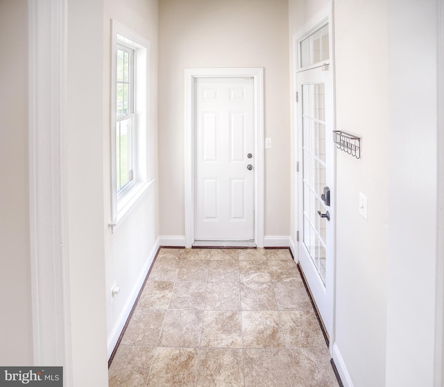 entryway featuring baseboards