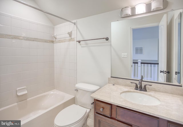 full bath with visible vents, vanity, toilet, shower / bath combination, and vaulted ceiling