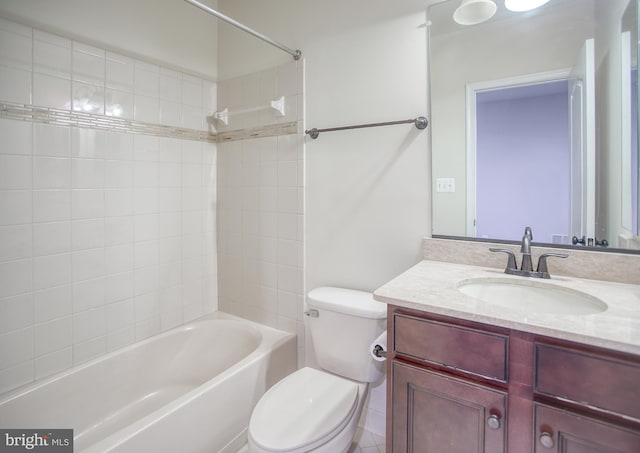 bathroom featuring vanity, toilet, and shower / washtub combination