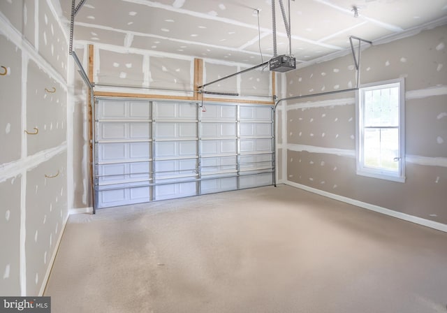garage featuring baseboards and a garage door opener