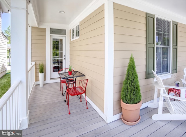 wooden terrace featuring a porch