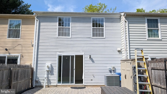 back of house with a patio, a fenced backyard, and cooling unit