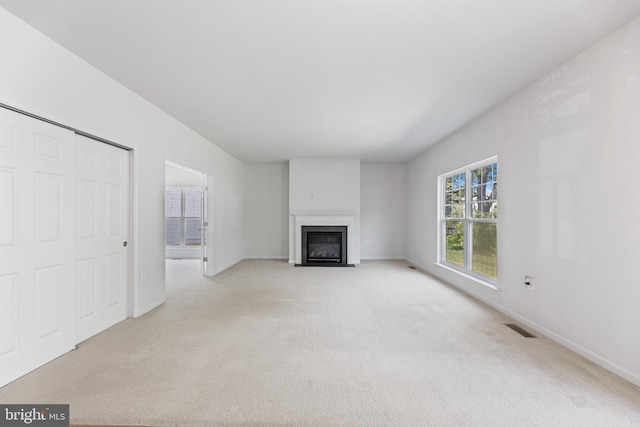 136 Roseville Ct, Boyce, VA 22620 - unfurnished living room with a fireplace with flush hearth, baseboards, light carpet, and visible vents