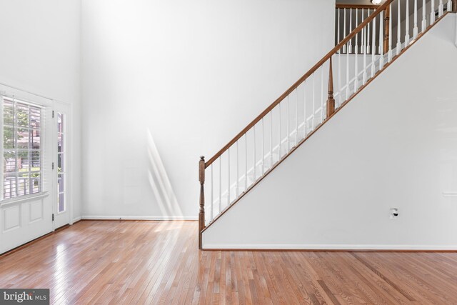 136 Roseville Ct, Boyce, VA 22620 - entrance foyer featuring baseboards, a high ceiling, stairs, and wood finished floors
