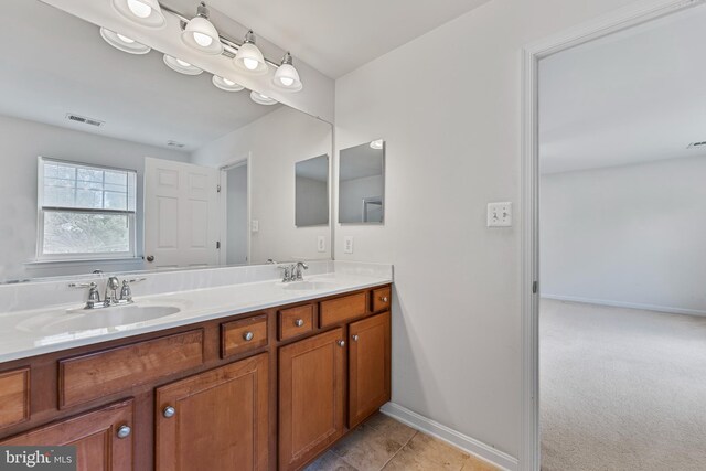 136 Roseville Ct, Boyce, VA 22620 - bathroom with double vanity, baseboards, visible vents, and a sink