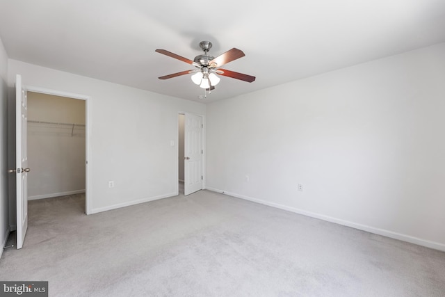 136 Roseville Ct, Boyce, VA 22620 - unfurnished bedroom with light colored carpet, a walk in closet, a ceiling fan, baseboards, and a closet