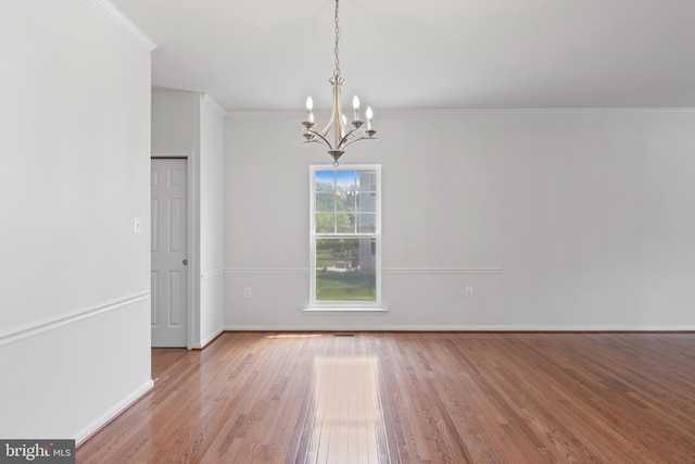 136 Roseville Ct, Boyce, VA 22620 - unfurnished dining area with an inviting chandelier, ornamental molding, baseboards, and wood finished floors
