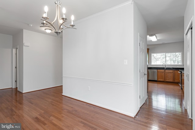 136 Roseville Ct, Boyce, VA 22620 - unfurnished dining area with a sink, baseboards, wood finished floors, and a chandelier