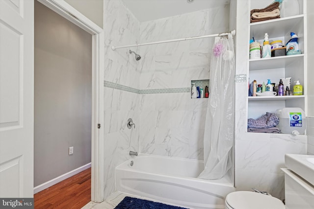 538 Moore St, Philadelphia, PA 19148 - bathroom with baseboards, toilet, wood finished floors, and shower / bath combination with curtain