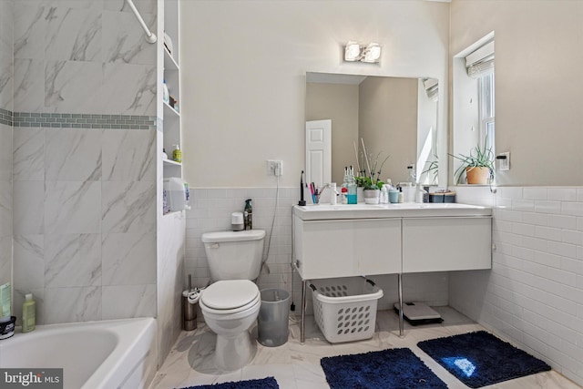 538 Moore St, Philadelphia, PA 19148 - full bathroom with wainscoting, toilet, and tile walls