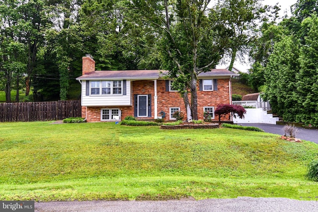 130 Great Lake Dr, Annapolis, MD 21403 - bi-level home featuring a chimney and brick siding