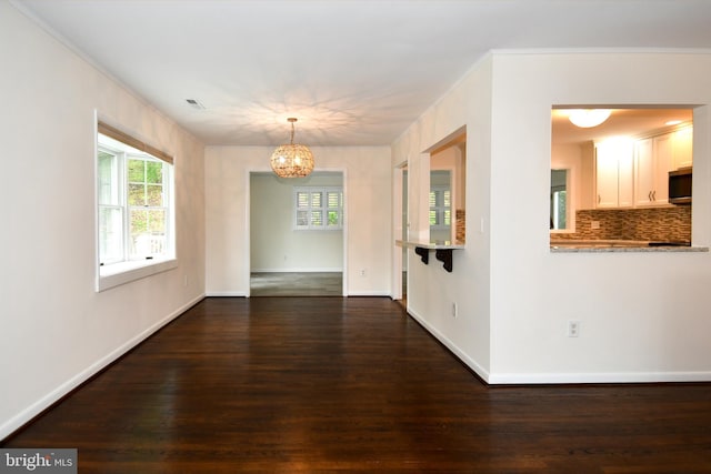 130 Great Lake Dr, Annapolis, MD 21403 - unfurnished dining area featuring a chandelier, dark wood-type flooring, healthy amount of natural light, and baseboards