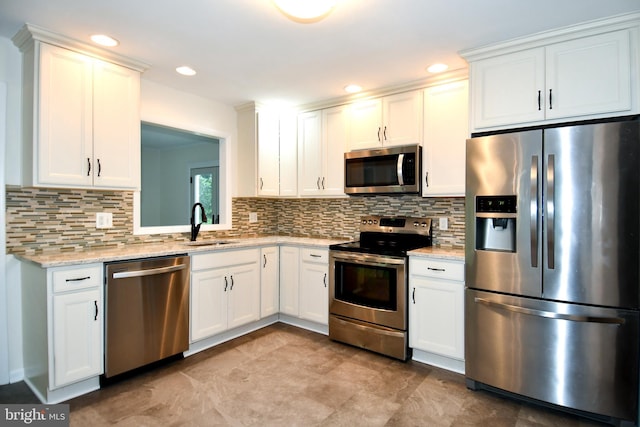 130 Great Lake Dr, Annapolis, MD 21403 - kitchen featuring stainless steel appliances, a sink, tasteful backsplash, white cabinetry, and recessed lighting