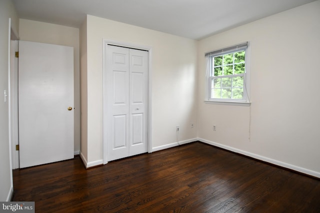 130 Great Lake Dr, Annapolis, MD 21403 - unfurnished bedroom featuring dark wood finished floors, baseboards, and a closet