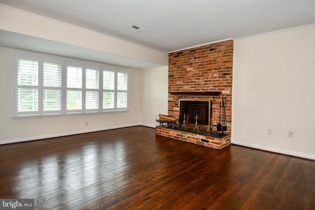 130 Great Lake Dr, Annapolis, MD 21403 - unfurnished living room featuring hardwood / wood-style flooring, plenty of natural light, a brick fireplace, baseboards, and ornamental molding