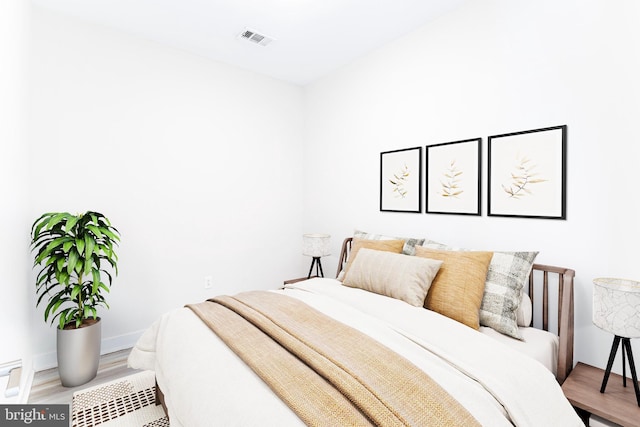 1350 Maryland Ave NE Unit 116, Washington, DC 20002 - bedroom with wood finished floors and visible vents