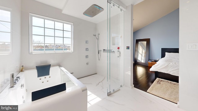ensuite bathroom featuring a tub with jets, ensuite bath, and a shower stall