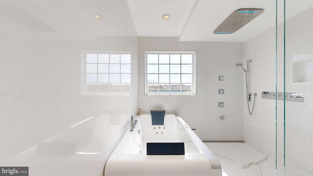 bathroom featuring recessed lighting and walk in shower