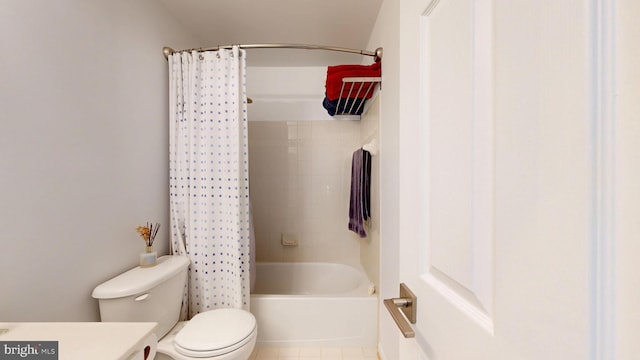 bathroom with vanity, shower / tub combo, tile patterned floors, and toilet