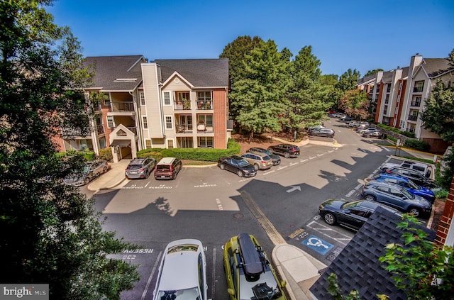 view of building exterior featuring uncovered parking