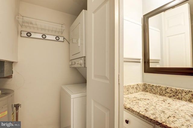 laundry area with stacked washer and clothes dryer and laundry area