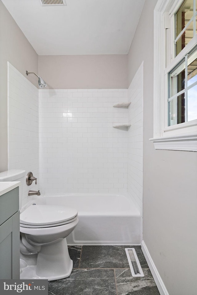 full bathroom featuring visible vents, vanity, toilet, and shower / washtub combination