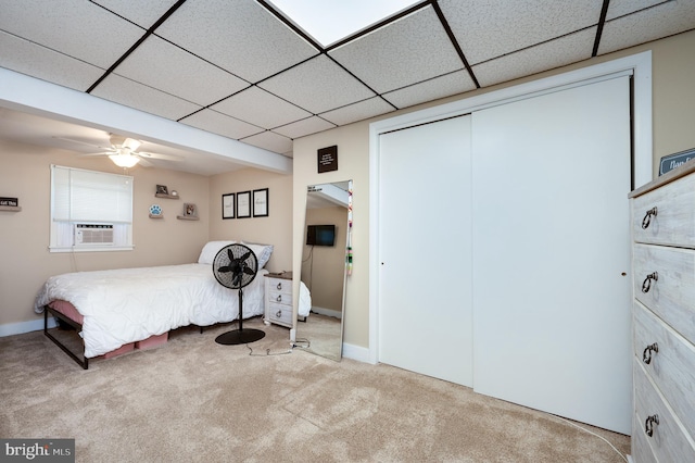 bedroom featuring carpet floors, a paneled ceiling, and cooling unit