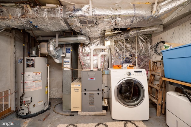 utility room featuring gas water heater, washer / clothes dryer, and visible vents