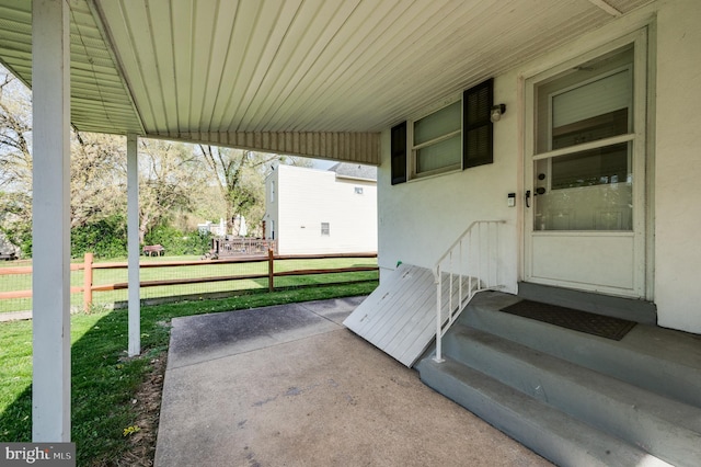 view of patio featuring fence