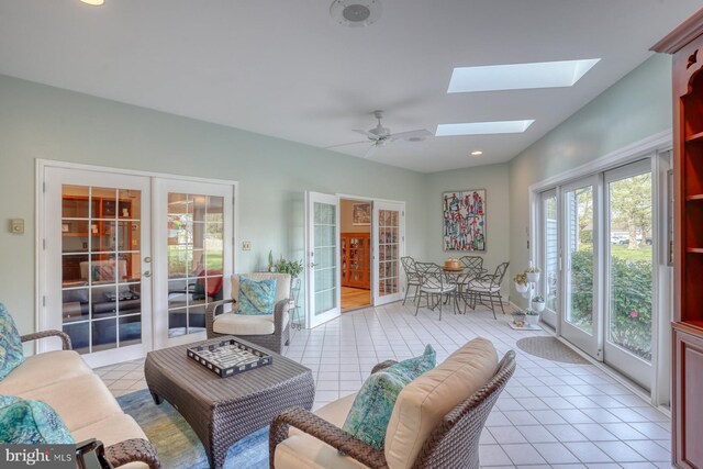 sunroom / solarium with a skylight and french doors