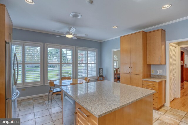 kitchen with crown molding, light stone countertops, recessed lighting, a ceiling fan, and stainless steel appliances