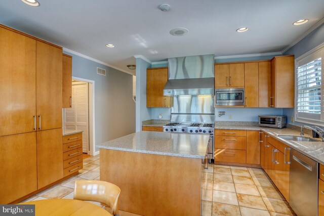 kitchen featuring visible vents, appliances with stainless steel finishes, a sink, ornamental molding, and wall chimney exhaust hood