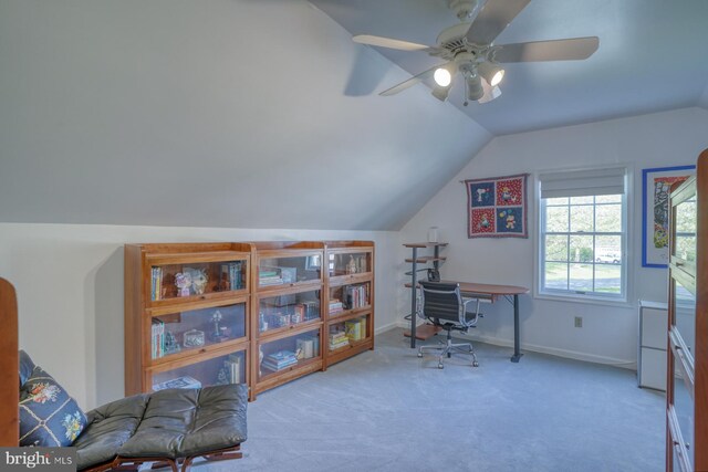 home office with baseboards, carpet flooring, a ceiling fan, and lofted ceiling