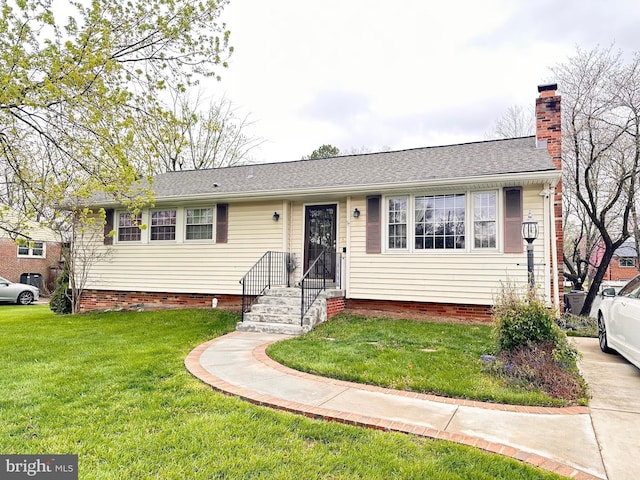 single story home with a shingled roof, a chimney, and a front yard