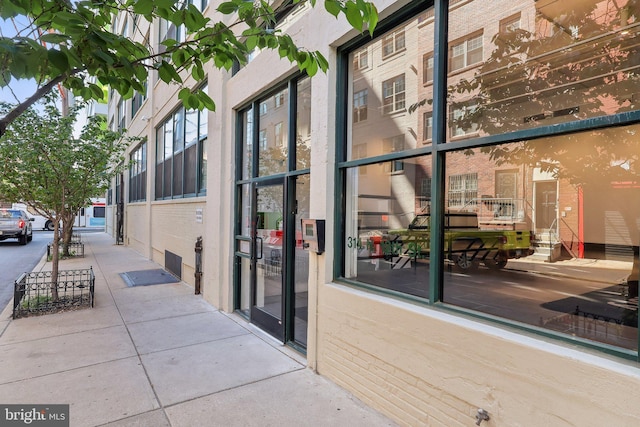 exterior space featuring brick siding