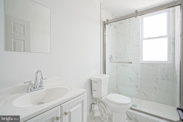 full bathroom with toilet, a marble finish shower, marble finish floor, and vanity
