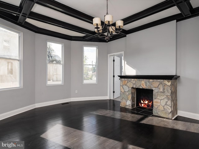 unfurnished living room featuring beamed ceiling, baseboards, a notable chandelier, and coffered ceiling