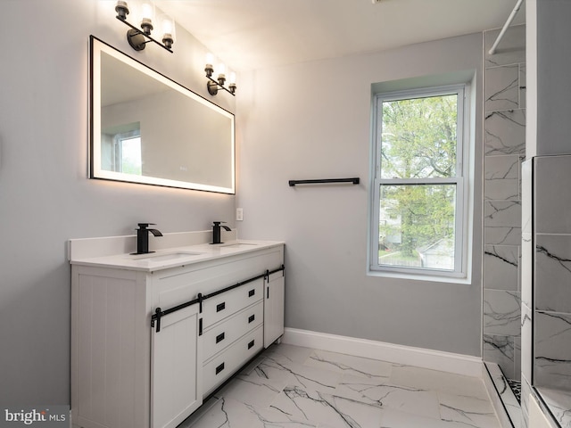 bathroom featuring double vanity, a sink, marble finish floor, and baseboards
