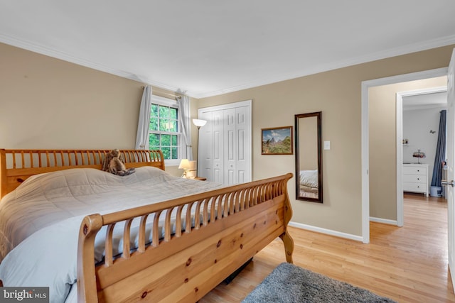 133 Teal Dr, Pasadena, MD 21122 - bedroom with light wood-type flooring, ornamental molding, baseboards, and a closet