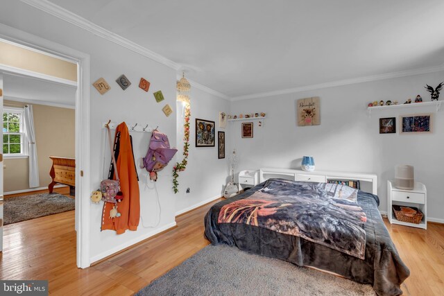 133 Teal Dr, Pasadena, MD 21122 - bedroom featuring light wood-style flooring, crown molding, and baseboards