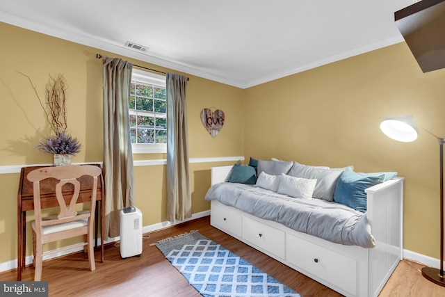 133 Teal Dr, Pasadena, MD 21122 - living area featuring wood finished floors, ornamental molding, and baseboards