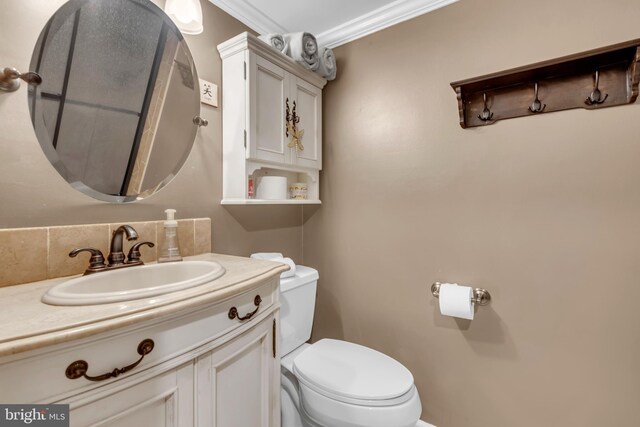 133 Teal Dr, Pasadena, MD 21122 - bathroom with toilet, ornamental molding, and vanity