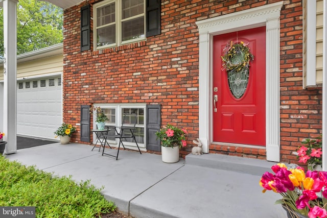 133 Teal Dr, Pasadena, MD 21122 - entrance to property featuring brick siding and a garage