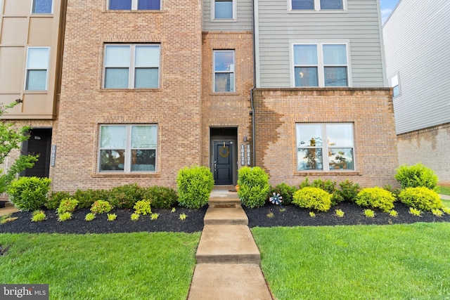 10424 Ratcliffe Trl, Manassas, VA 20110 - view of front facade with brick siding and a front yard