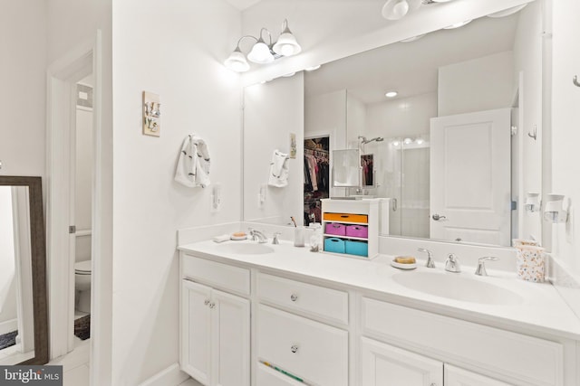 10424 Ratcliffe Trl, Manassas, VA 20110 - bathroom with a sink, double vanity, toilet, and a stall shower